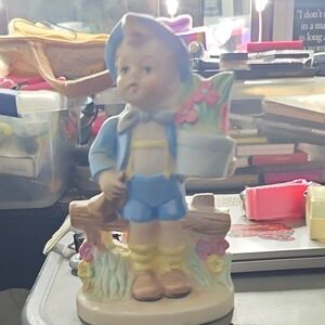 Charming Boy Figurine with Flowers